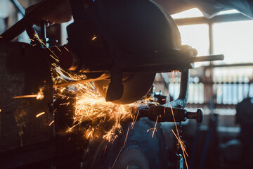 Machine sharpening tools in workshop of a carpentry