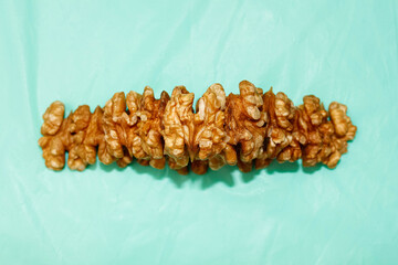 Walnut kernels are stacked on top of each other.