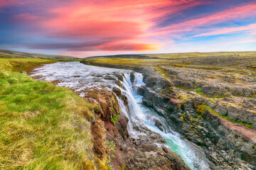 Breathtaking view of  Kolufossar waterfall at sunset.