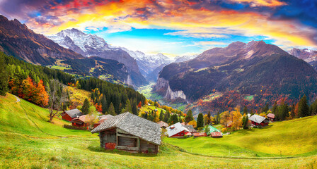 Fabulous autumn view of picturesque alpine Wengen village and Lauterbrunnen Valley