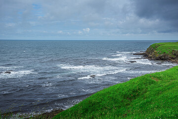 Sea coast in cloudy rainy weather. The coast of the sea.