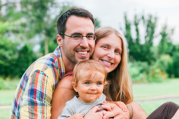 Happy young family in garden