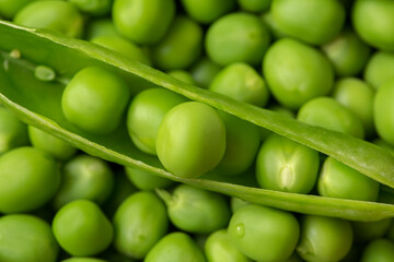 Fresh green peas as background texture close-up.