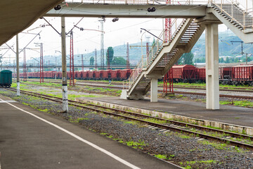 Landscape with railroad tracks in railway station, Vanadzor. Abandoned railway station returns to nature.