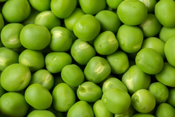 Fresh green peas as background texture close-up.