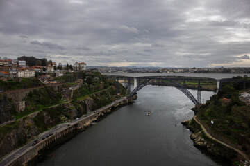 Naklejka premium View of the Douro River and the Ponte de D. Maria Pia and Ponte de São João Railway Bridge.