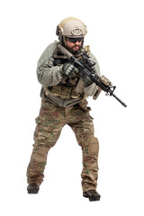 American soldier in military equipment with a rifle attacks on a white background, a commando with weapons in uniform, a ranger in action