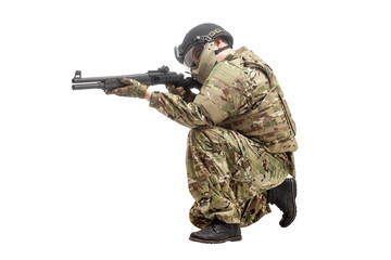 military commando in uniform with a shotgun attacks and aims on a white background, soldier in...