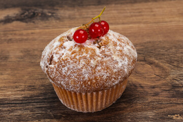 Sweet tasty muffin with red currants