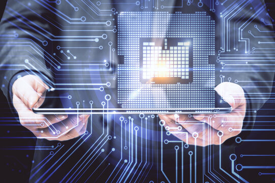 Businessman hands holding digital tablet with circuit hologram.