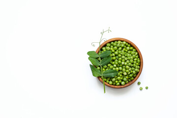 Young green peas organic in a wooden bowl