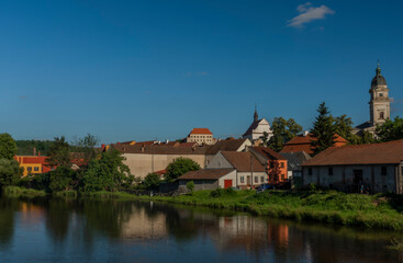 Fototapeta na wymiar View from road bridge over Jihlava river in Dolni Kounice village in summer day