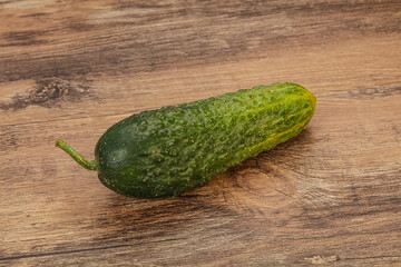 Green ripe fresh cucumber over background