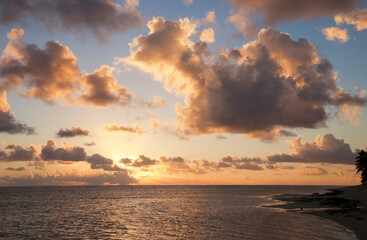 Cloudscape over Ocean and Island at Sunset