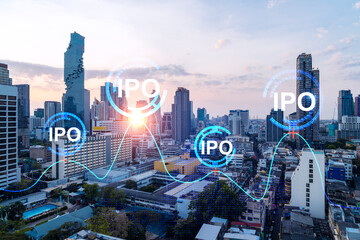 Hologram of IPO glowing icon, sunset panoramic city view of Bangkok. The financial hub for...