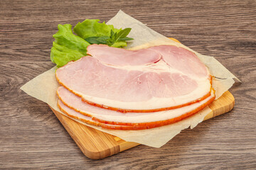 Sliced pork belly over board