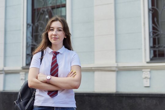 Portrait Of Girl Student Of 17, 18 Years Old In White T-shirt With Backpack