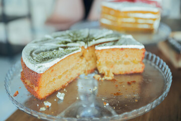 Delicious cake on top of wooden table in hotel breakfast.