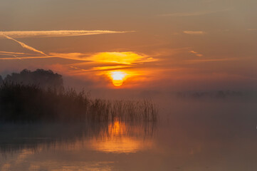 Obraz premium Beautiful sunrise on the lake. Polish sunrise