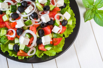 Mediterranean salad with feta cheese, tomatoes, cucumbers and olives