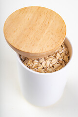 Oatmeal in a ceramic container. Healthy food prepared for breakfast.