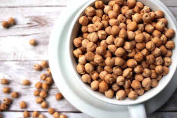 uncooked fresh dry chickpeas (garbanzo beans) in a cup