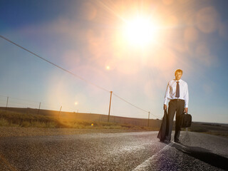 Businessman in suit lost in the desert