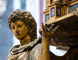 Statue Holding up a Box