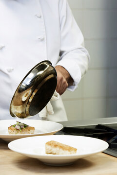 Collage Of Chef Cooking Pan Fried Cod In Kitchen