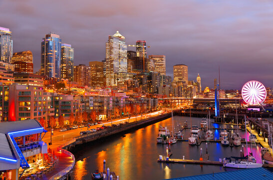 Seattle Skyline Showing The Waterfront Of Seattle After Sunset. The Central Waterfront Of Seattle, Is The Most Urbanized Portion Of  Elliott Bay Shore.