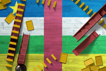 Central African Republic flag with national background with dominoes on wooden table. Top view. Concept of game.