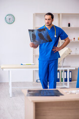 Young male doctor radiologist working in the clinic