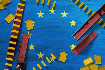 European Union flag with national background with dominoes on wooden table. Top view. Concept of...
