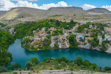 Fototapeta na wymiar Sanliurfa, Halfeti, blue lake and green trees, hidden paradise, old houses 