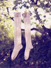 Pair of socks drying on clothesline