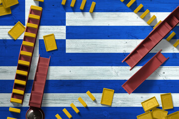 Greece flag with national background with dominoes on wooden table. Top view. Concept of game.