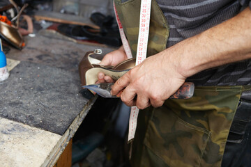 Shoemaker Repairing High Heel Shoe