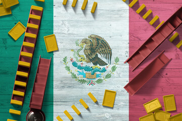 Mexico flag with national background with dominoes on wooden table. Top view. Concept of game.