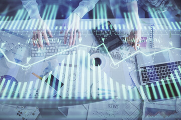 Double exposure of man and woman working together and data theme hologram drawing. Computer background. Top View.