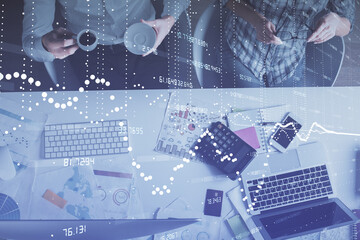 Double exposure of man and woman working together and data theme hologram drawing. Computer background. Top View.