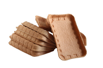 Biodegradable food trays made from pressed cardboard isolated on white background. Closeup