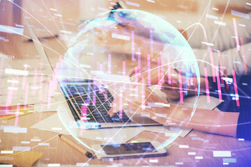 Multi exposure of woman hands typing on computer and financial chart hologram drawing. Stock market...
