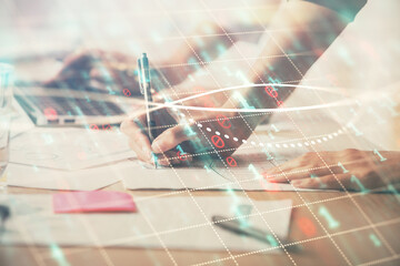Multi exposure of woman hands typing on computer and financial chart hologram drawing. Stock market...