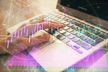 Double exposure of woman hands typing on computer and forex chart hologram drawing. Stock market analysis concept.