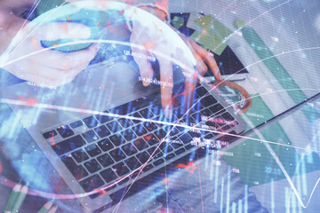 Double exposure of woman hands typing on computer and forex chart hologram drawing. Stock market invest concept.