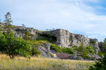 Foto op Canvas Limestone cliff face under blue cloudy sky © It4All