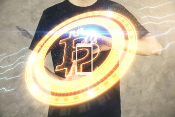 Double exposure of man's hands holding and using a phone and crypto currency blockchain theme drawing.