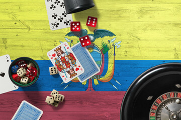 Ecuador casino theme. Aces in poker game, cards and chips on red table with national wooden flag background. Gambling and betting.