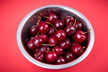 close up view for fresh dark sweet cherry with drops. healthy eating concept.
