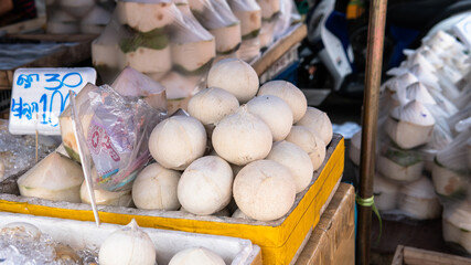 .sale of coconuts in the fruit markets of Asia. Benefits of Coconut Milk and Pulp